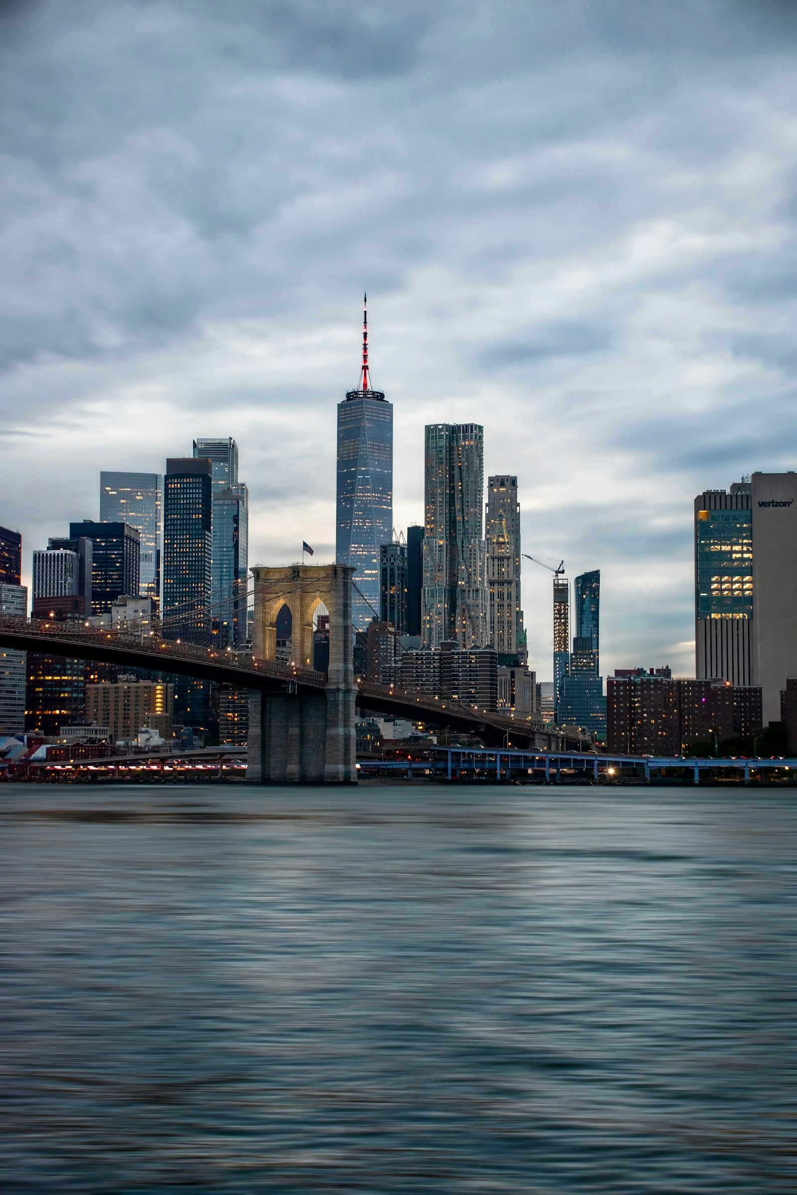 New York City skyline with the Brooklyn Bridge at dusk
