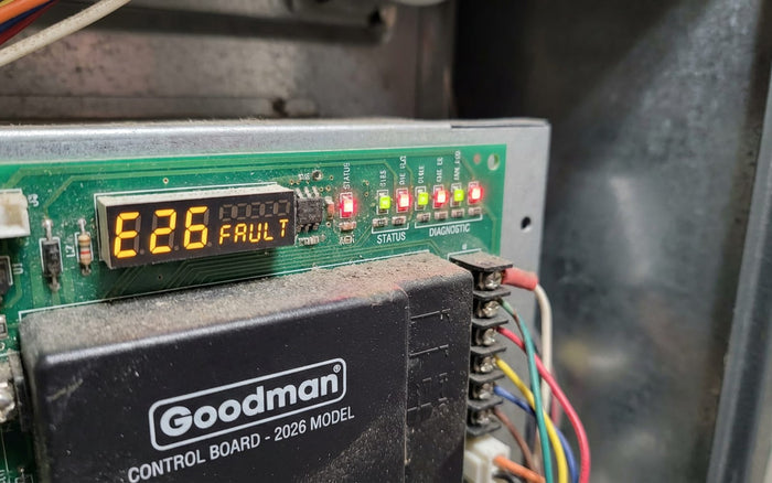 Goodman furnace control board showing an E26 fault code