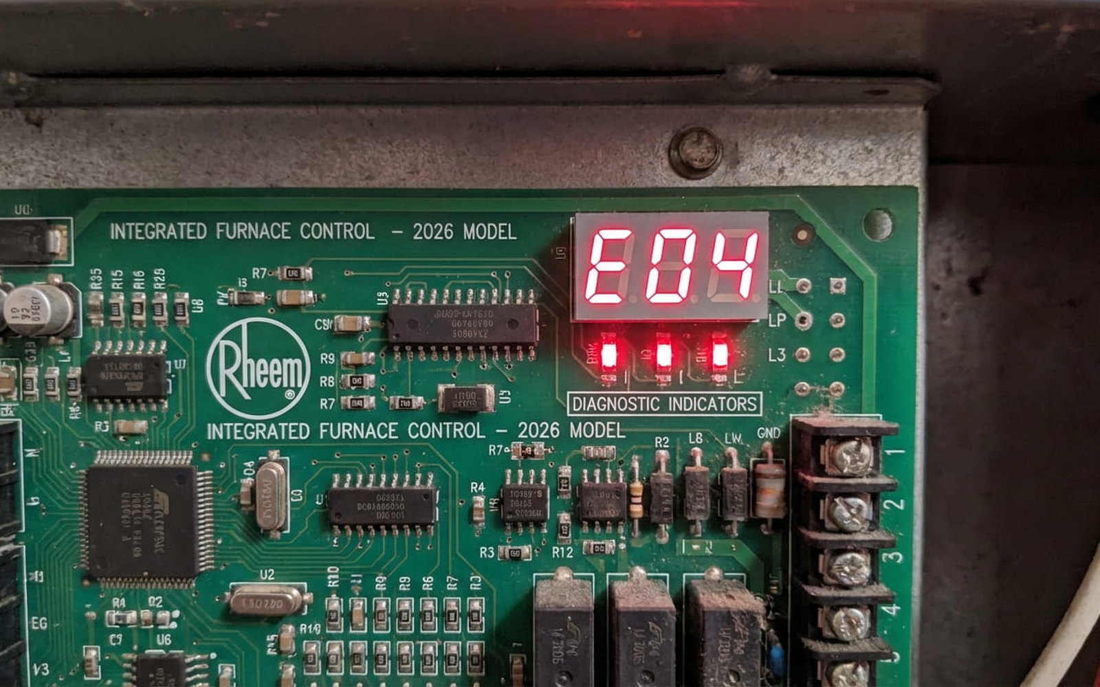Rheem furnace control board showing an E04 error code